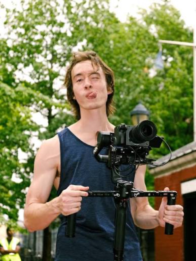 Charlie Hooper holding a camera rig