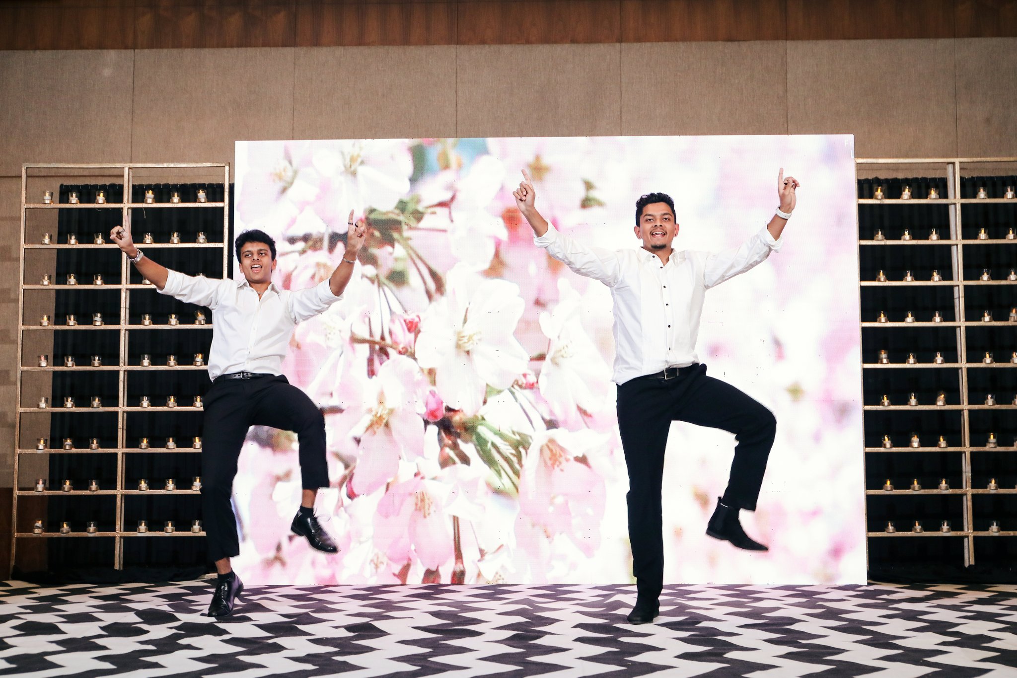 Wide event photo of two dancers performing on stage