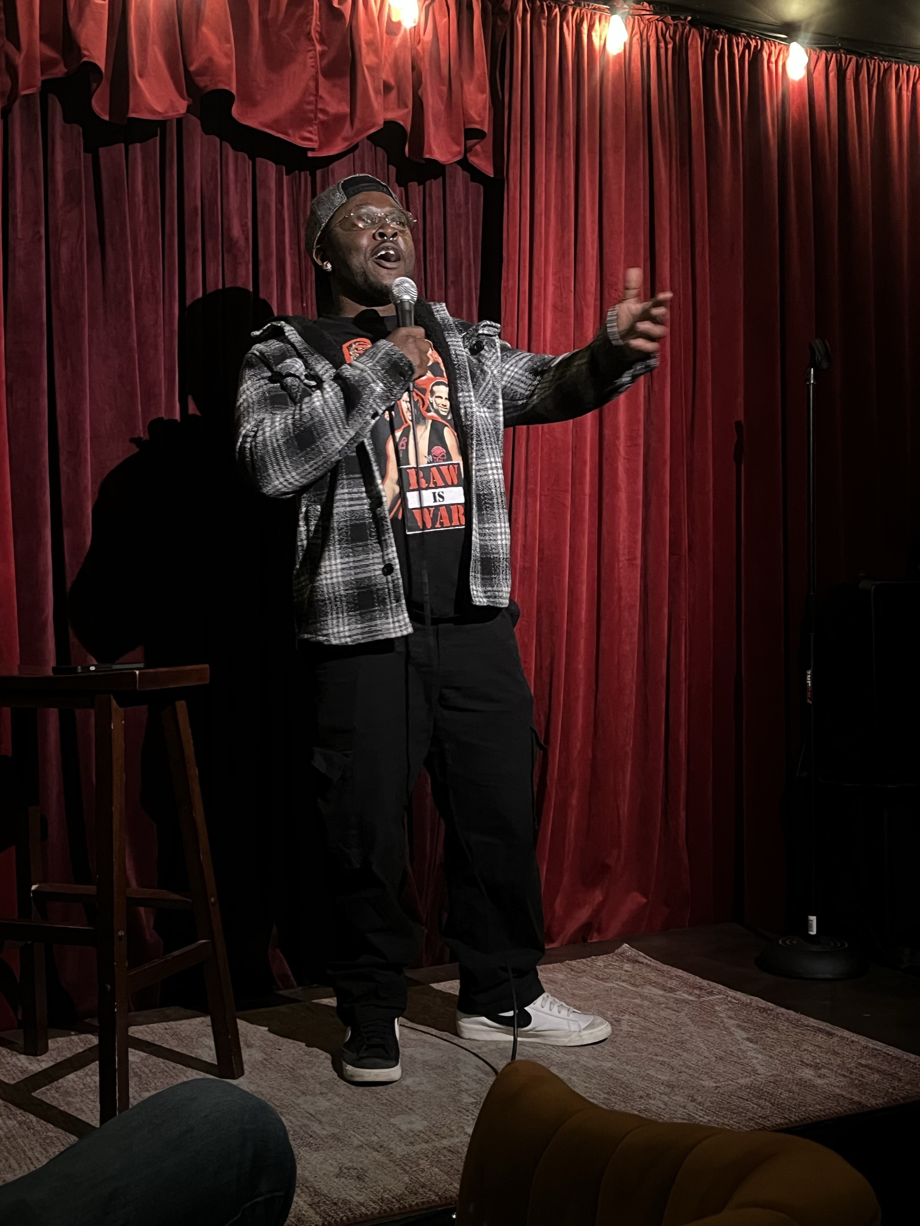 Rick Blaze performing stand-up comedy on stage