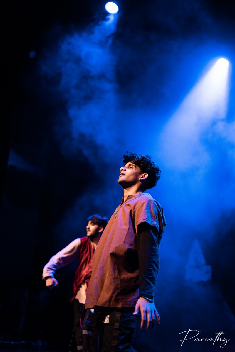 Yuvhan Suresh performing during a dance routine on stage